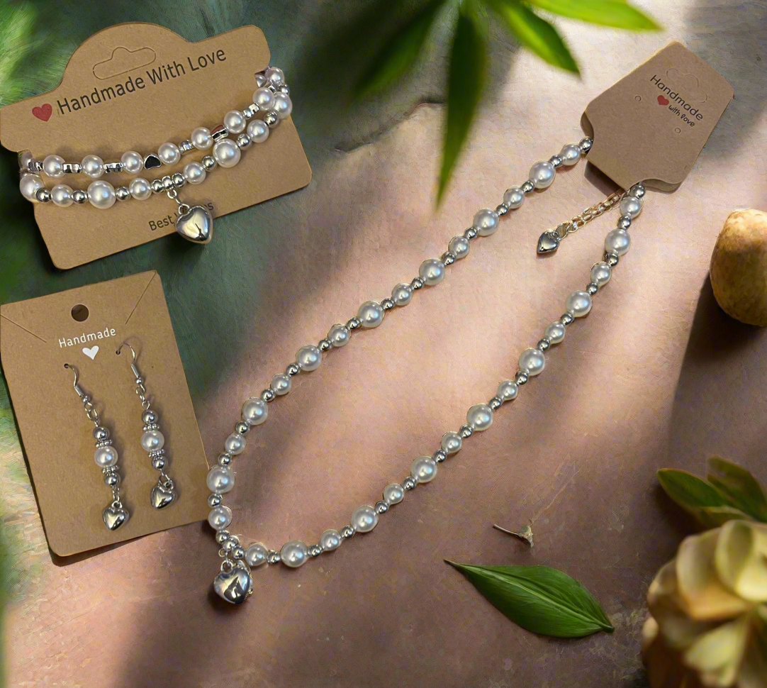 Elegant pearl necklace with heart charm set.