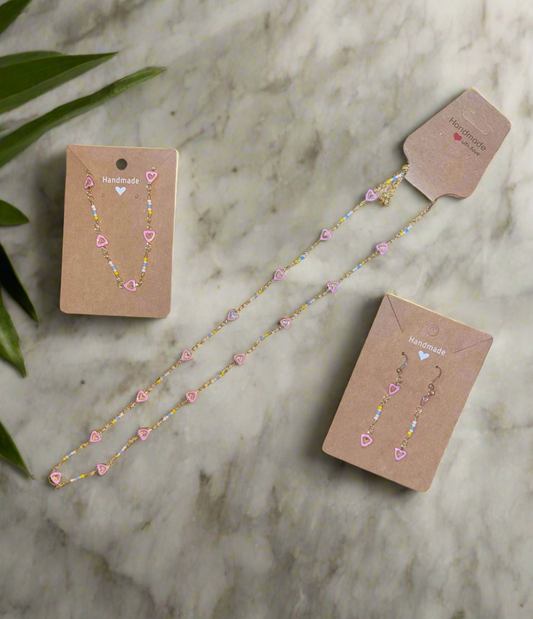 Gold and pink hearts necklace set.