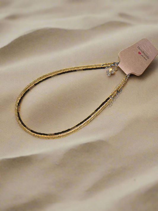 Minimalist black and gold choker.