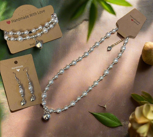 Elegant pearl necklace with heart charm set.